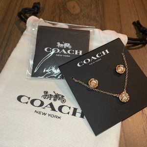 Coach rose gold plated brass necklace and earring set.